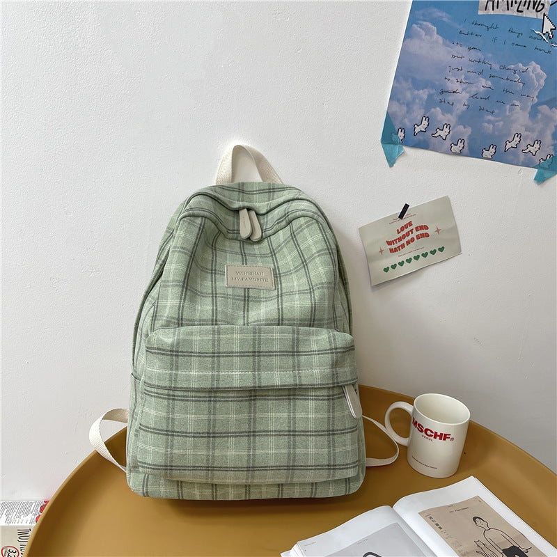 Chic Checkmate: The Plaid Perfection Backpack